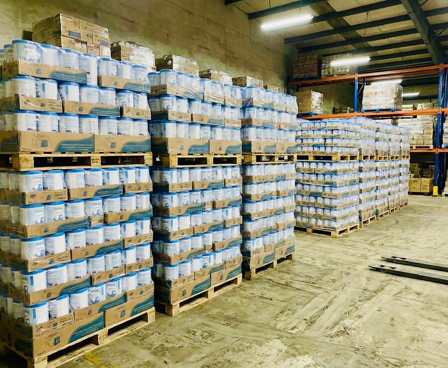 Bulk wholesale stock of Pakiza Laundry Cream on pallets ready for dealer delivery across Pakistan